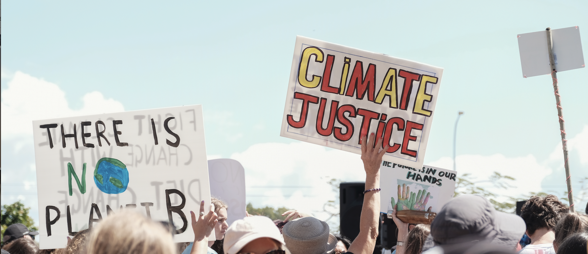 Image of a protest sign "Climate Justice"