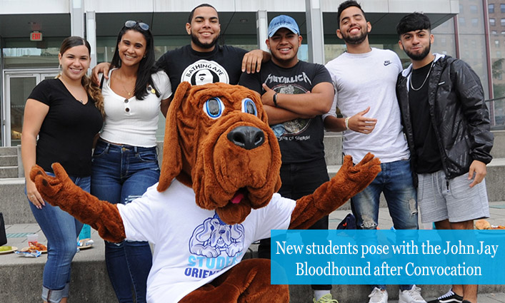 New students pose with the John Jay Bloodhound after Convocation