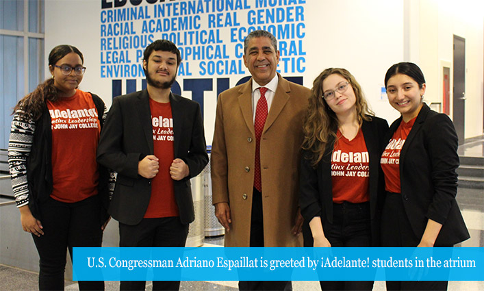 U.S. Congressman Adriano Espaillat is greeted by Adelante students in the atrium