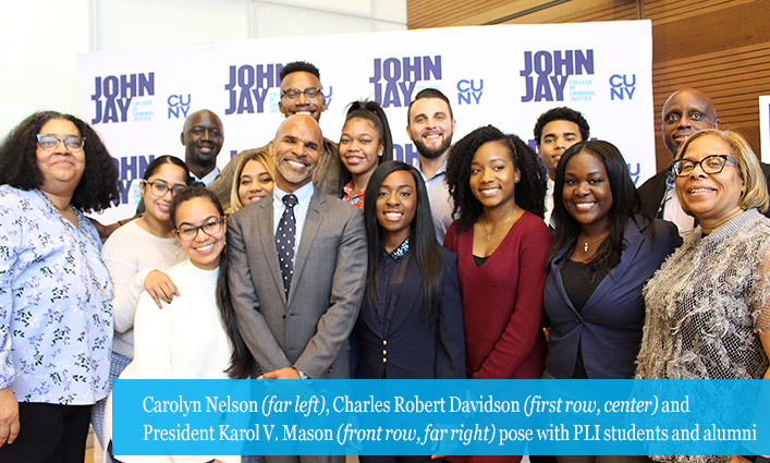 Carolyn Nelson (far left), Charles Robert Davidson (first row, center) and President Karol V. Mason (front row, far right) pose with PLI students and alumni