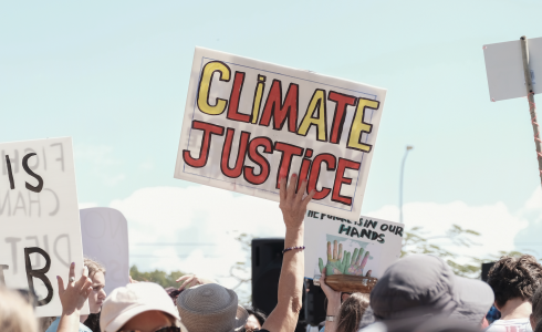 Image of a protest sign "Climate Justice"