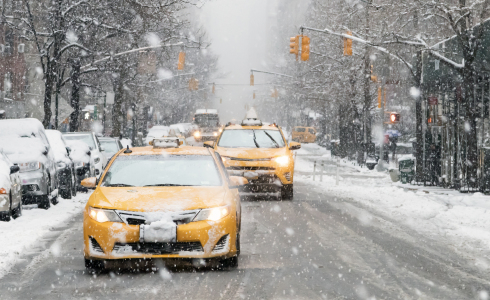 Image of Cabs Driving in New York City in the Snow