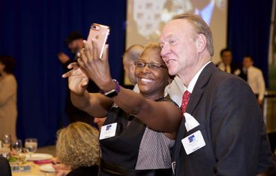 Guests taking selfies at the Alumni Reunion