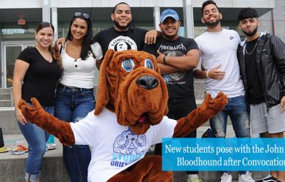 New students pose with the John Jay Bloodhound after Convocation