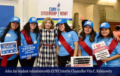 John Jay student volunteers with CUNY Interim Chancellor Vita C. Rabinowitz