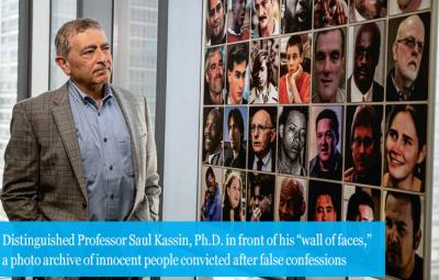 Distinguished Professor Saul Kassin, Ph.D. in front of his “wall of faces,” a photo archive of innocent people convicted after false confessions