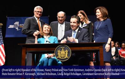 Speaker of the House, Nancy Pelosi and New York Governor, Andrew Cuomo (back left to right) New York State Senator Brian P. Kavanagh, Michael Schulman, Linda Beigel Schulman, Lieutenant Governor Kathy Hochul