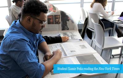 John jay students reading newspaper